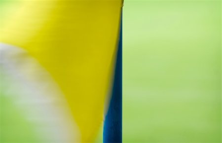simsearch:400-03928997,k - Yellow corner flag on a football field waving in the wind. Photographie de stock - Aubaine LD & Abonnement, Code: 400-03946331