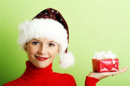 shocked face animal - winter portrait of a beautiful young smiling woman with a gift in her hand Stock Photo - Budget Royalty-Free & Subscription, Code: 400-03947271
