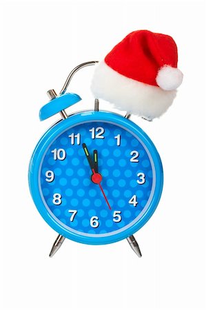 simsearch:614-03903058,k - Blue alarm clock with christmas hat on top, isolated on white background Foto de stock - Royalty-Free Super Valor e Assinatura, Número: 400-03947304