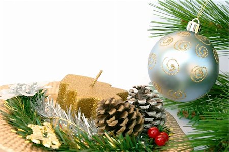 Christmas gray ball on the fir-tree and golden dish with holly-berry,cones,candle. Stock Photo - Budget Royalty-Free & Subscription, Code: 400-03947741
