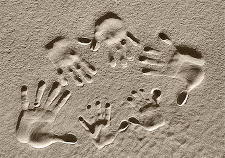 A family of handprints pressed into the sand Stock Photo - Budget Royalty-Free & Subscription, Code: 400-03947970