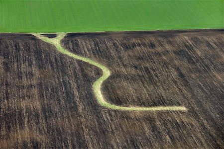 simsearch:877-08898066,k - Aerial view of farmland with curvy path. Photographie de stock - Aubaine LD & Abonnement, Code: 400-03948637