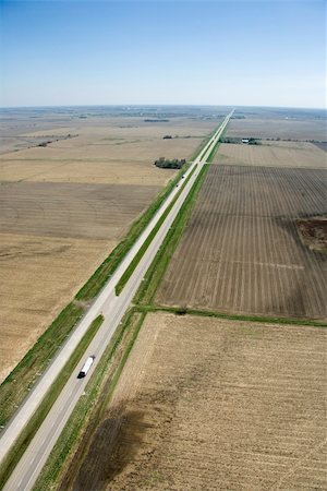 simsearch:6102-08520618,k - Aerial view of highway through rural farmland with crops. Stock Photo - Budget Royalty-Free & Subscription, Code: 400-03948641