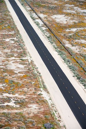 simsearch:400-03948660,k - Aerial of two lane highway through desolate landscape. Stock Photo - Budget Royalty-Free & Subscription, Code: 400-03948794