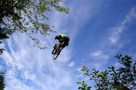 A mountain biker takes off during a contest in Whistler, BC, Canada. Stock Photo - Budget Royalty-Free & Subscription, Code: 400-03948871