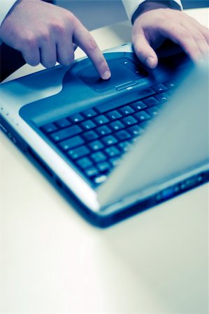 close-up view of hands touching and typing laptop on table Stock Photo - Budget Royalty-Free & Subscription, Code: 400-03949015