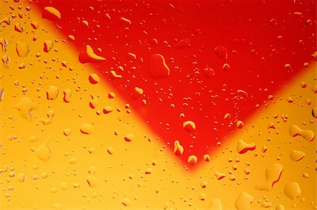 simsearch:670-05652999,k - Water drops on clear glass with yellow/red background Stock Photo - Budget Royalty-Free & Subscription, Code: 400-03949032