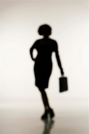 Soft focus silhouette of businesswoman holding briefcase. Stock Photo - Budget Royalty-Free & Subscription, Code: 400-03949163