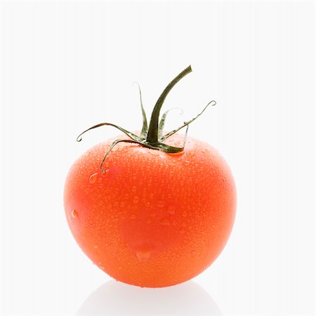 simsearch:700-00061966,k - Still life of wet red ripe tomato against white background. Stockbilder - Microstock & Abonnement, Bildnummer: 400-03949215