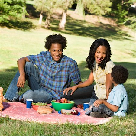 Smiling happy parents and son having picnic in park. Stock Photo - Budget Royalty-Free & Subscription, Code: 400-03949274