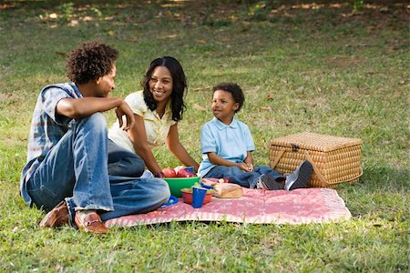 Smiling happy parents and son having picnic in park. Stock Photo - Budget Royalty-Free & Subscription, Code: 400-03949276