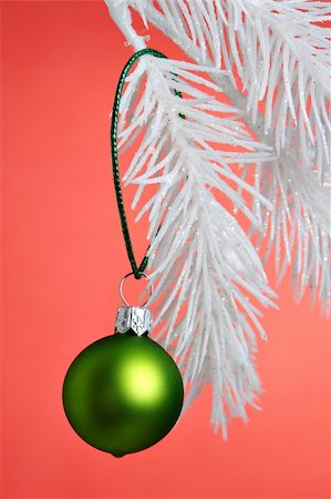 simsearch:632-03027631,k - Green Christmas Ornament hanging on a tree branch. Stock Photo - Budget Royalty-Free & Subscription, Code: 400-03949517