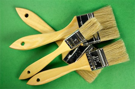 simsearch:400-03949646,k - Stack of brushes on green Stock Photo - Budget Royalty-Free & Subscription, Code: 400-03949657