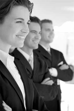 simsearch:633-02231795,k - black and white one female two males wearing business suits in a row smiling Foto de stock - Super Valor sin royalties y Suscripción, Código: 400-03940263