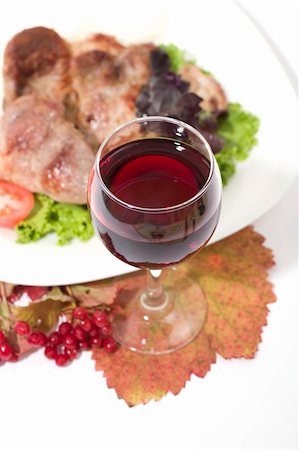 simsearch:400-04846972,k - Glass of red wine with juicy roasted meat. Low DOF, focus is on wine Stock Photo - Budget Royalty-Free & Subscription, Code: 400-03940312