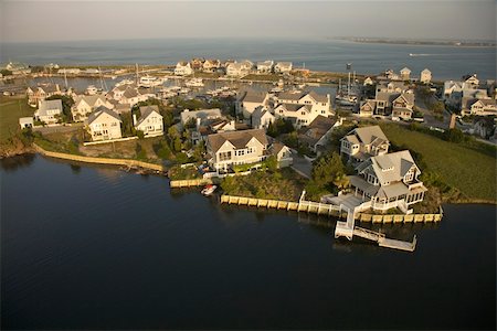 simsearch:400-03943979,k - Aerial view of houses and ocean at Bald Head Island, North Carolina. Foto de stock - Super Valor sin royalties y Suscripción, Código: 400-03940568