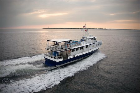 simsearch:400-03940604,k - Passenger ferry crossing sea at Bald Head Island, North Carolina. Stock Photo - Budget Royalty-Free & Subscription, Code: 400-03940571