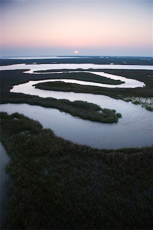 simsearch:400-03940566,k - Aerial scenic view of winding waterway in marshland at Baldhead Island, North Carolina. Photographie de stock - Aubaine LD & Abonnement, Code: 400-03940580