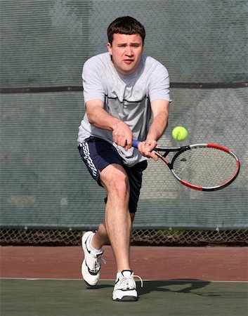 simsearch:400-08755898,k - Young man playing tennis Stock Photo - Budget Royalty-Free & Subscription, Code: 400-03940778