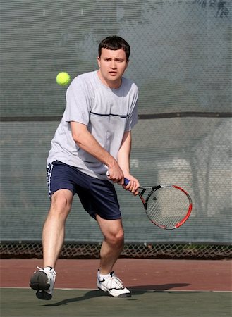 simsearch:400-08755898,k - Young man playing tennis Stock Photo - Budget Royalty-Free & Subscription, Code: 400-03941043