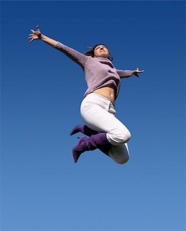 simsearch:400-04450996,k - Young woman jumping high Stock Photo - Budget Royalty-Free & Subscription, Code: 400-03941071