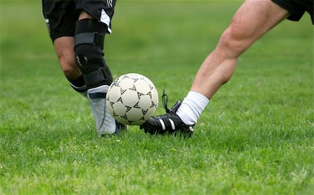 simsearch:400-06513403,k - Two men playing soccer Stock Photo - Budget Royalty-Free & Subscription, Code: 400-03941206