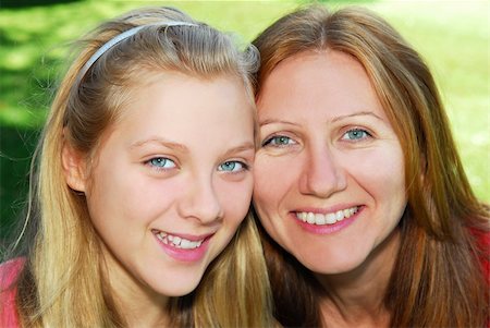 simsearch:400-04612785,k - Portrait of a smiling mother and teenage daughter in summer park Stock Photo - Budget Royalty-Free & Subscription, Code: 400-03941395