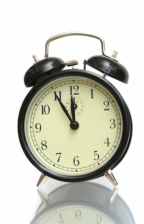 The black alarm clock is isolated on a white background Stockbilder - Microstock & Abonnement, Bildnummer: 400-03941408