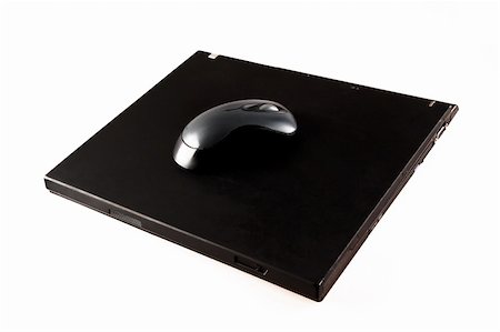 isolated black closed laptop computer Stock Photo - Budget Royalty-Free & Subscription, Code: 400-03941672