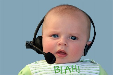 simsearch:400-04291703,k - Baby with a headset on a blue background Stock Photo - Budget Royalty-Free & Subscription, Code: 400-03941867