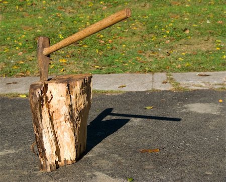 power ax - Axe in the process of splitting a log for firewood. Stock Photo - Budget Royalty-Free & Subscription, Code: 400-03942054