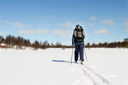 simsearch:400-04520291,k - A skier on a wintery snow filled landscape. Stockbilder - Microstock & Abonnement, Bildnummer: 400-03942237