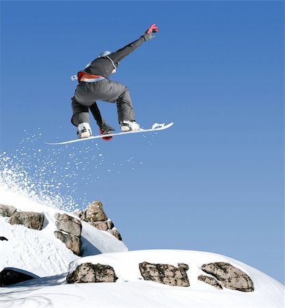 simsearch:400-03938721,k - Snowboarder jumping high in the air Photographie de stock - Aubaine LD & Abonnement, Code: 400-03942494