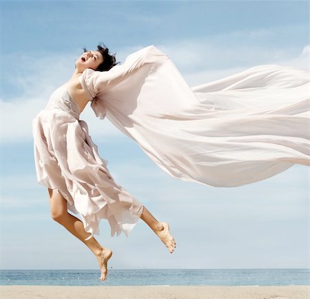 simsearch:400-04123668,k - Woman jumping on the beach Stock Photo - Budget Royalty-Free & Subscription, Code: 400-03942509