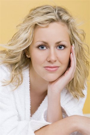 simsearch:400-03920671,k - Studio shot beautiful young blond woman wearing a bathrobe looking restful and relaxed Stock Photo - Budget Royalty-Free & Subscription, Code: 400-03942795