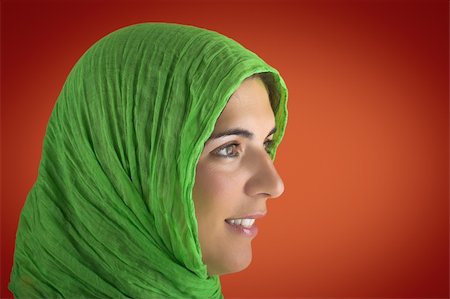 simsearch:400-03965676,k - Beautiful woman portrait in a red background with a green handkerchiefs Foto de stock - Super Valor sin royalties y Suscripción, Código: 400-03942916