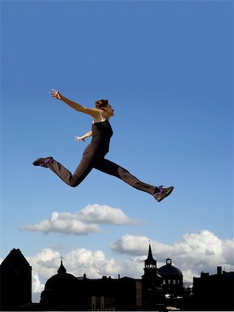 female athletic high jump - Young woman flying above the city Stock Photo - Budget Royalty-Free & Subscription, Code: 400-03943583