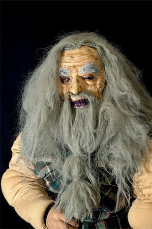 Halloween mask of a scary looking old man with long gray hair and beard Stock Photo - Budget Royalty-Free & Subscription, Code: 400-03943624