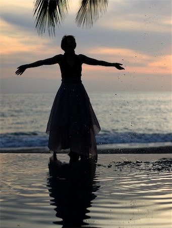 Woman and her reflection in a pool by the ocean Stock Photo - Budget Royalty-Free & Subscription, Code: 400-03943766