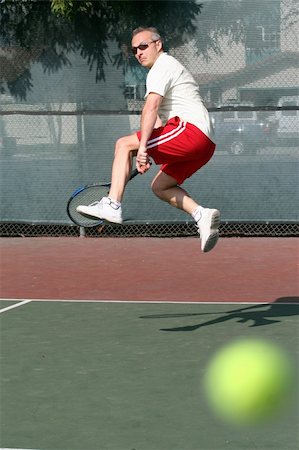 simsearch:400-08755898,k - Middleage man playing tennis Stock Photo - Budget Royalty-Free & Subscription, Code: 400-03943767