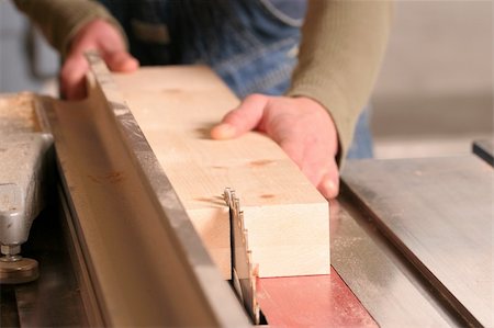 A piece of pine being ripped on an industrial tablesaw. Stock Photo - Budget Royalty-Free & Subscription, Code: 400-03943802