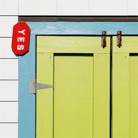 simsearch:400-03943979,k - Detail of colorful doors with sign reading "yes" at Bald Head Island, North Carolina. Foto de stock - Super Valor sin royalties y Suscripción, Código: 400-03943956