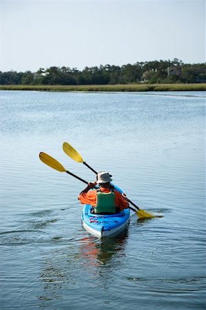 saladar - Back view of African American middle-aged couple paddling kayak. Photographie de stock - Aubaine LD & Abonnement, Code: 400-03943975