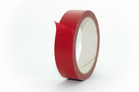 ruban-cache - Close-up of a roll of red masking tape over white. Photographie de stock - Aubaine LD & Abonnement, Code: 400-03943996