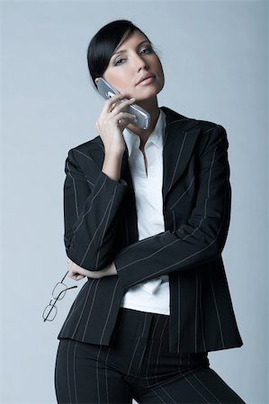 simsearch:400-04164036,k - Beautiful brunette business woman talking cell phone isolated on clear background Foto de stock - Super Valor sin royalties y Suscripción, Código: 400-03954137