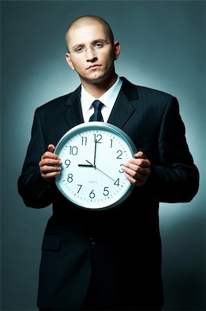 simsearch:400-03954954,k - A Young businessman checking his watch. Time is money Foto de stock - Super Valor sin royalties y Suscripción, Código: 400-03954995