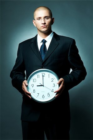 simsearch:400-03954954,k - A Young businessman checking his watch. Time is money Foto de stock - Super Valor sin royalties y Suscripción, Código: 400-03954996