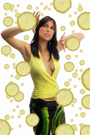 pretty girl with colored dress and pieces of fruit all around her Stock Photo - Budget Royalty-Free & Subscription, Code: 400-03955261