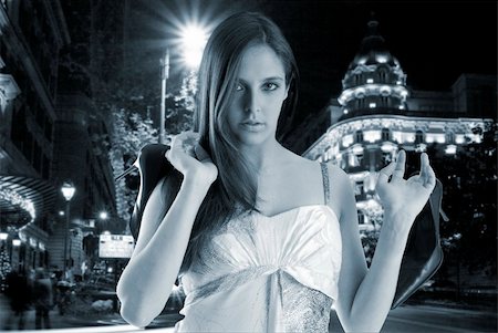 simsearch:400-04759494,k - a chic young woman in the night going back home and bringing her shoes with the hands Stock Photo - Budget Royalty-Free & Subscription, Code: 400-03955285