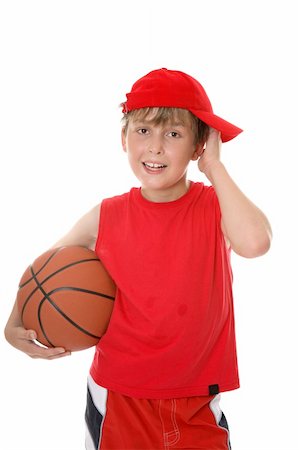 Flushed child holding a basketball aftera game. Stock Photo - Budget Royalty-Free & Subscription, Code: 400-03955411